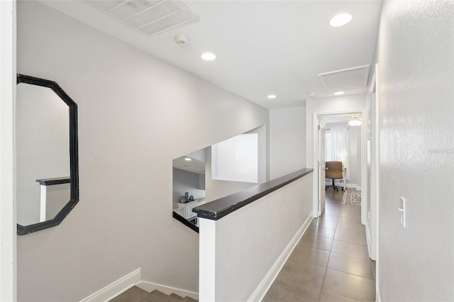 corridor featuring visible vents, an upstairs landing, and recessed lighting