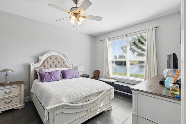bedroom featuring tile patterned floors and ceiling fan