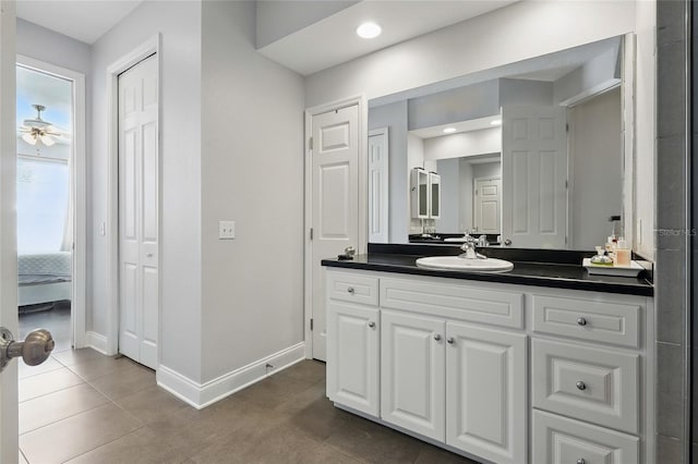 bathroom with vanity, baseboards, recessed lighting, tile patterned floors, and ceiling fan