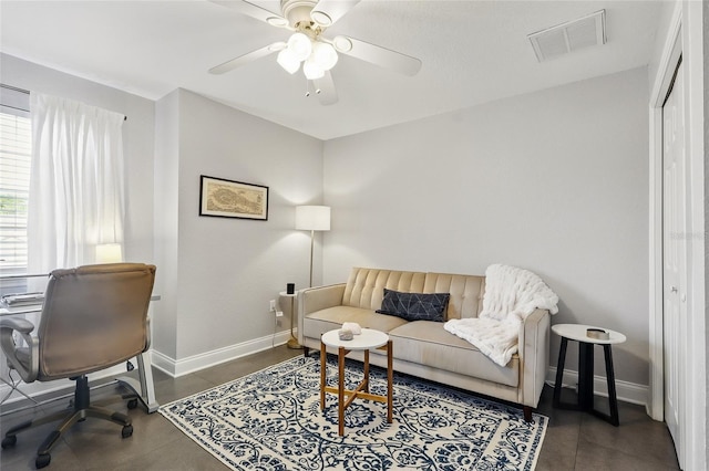 office area featuring visible vents, baseboards, and a ceiling fan