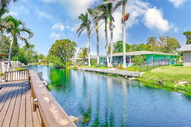 property view of water featuring fence
