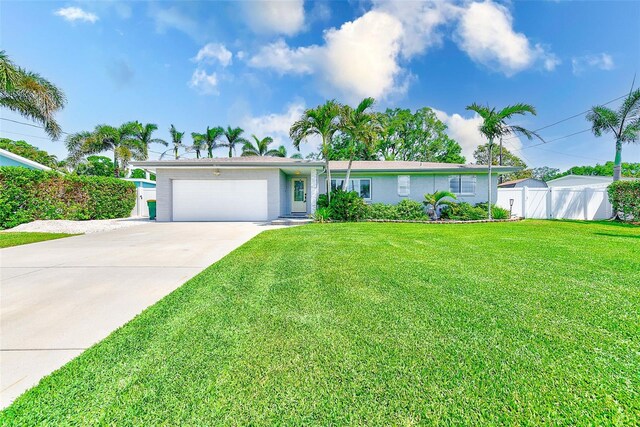 11035 Huron Rd, Saint Petersburg, FL 33708 - ranch-style house with an attached garage and concrete driveway