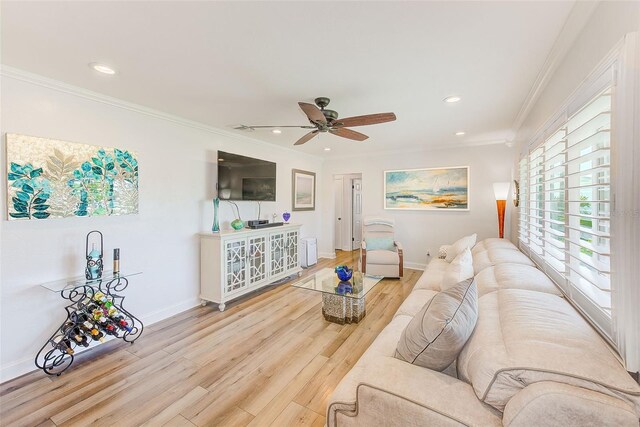 11035 Huron Rd, Saint Petersburg, FL 33708 - living room with ceiling fan, wood finished floors, recessed lighting, baseboards, and crown molding