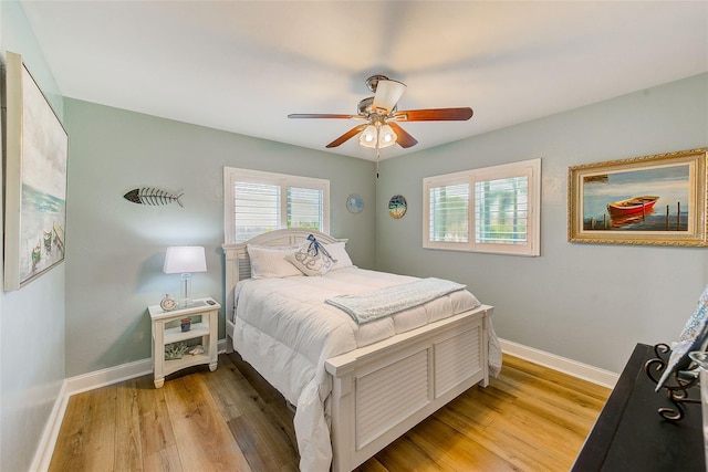 11035 Huron Rd, Saint Petersburg, FL 33708 - bedroom featuring light wood-style floors, baseboards, and a ceiling fan
