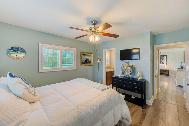 11035 Huron Rd, Saint Petersburg, FL 33708 - bedroom featuring wood finished floors, baseboards, and ceiling fan