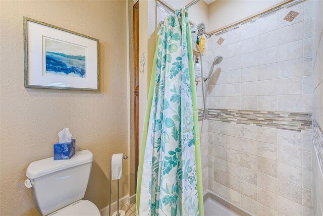 11035 Huron Rd, Saint Petersburg, FL 33708 - full bathroom featuring toilet and a tile shower