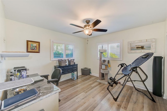 11035 Huron Rd, Saint Petersburg, FL 33708 - office area with healthy amount of natural light, light wood-type flooring, ceiling fan, and baseboards