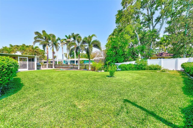 11035 Huron Rd, Saint Petersburg, FL 33708 - view of yard featuring a sunroom