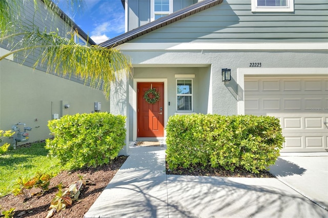 entrance to property with stucco siding