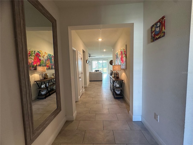 33034 Sand Creek Dr, Wesley Chapel, FL 33543 - corridor featuring baseboards, tile patterned floors, and recessed lighting