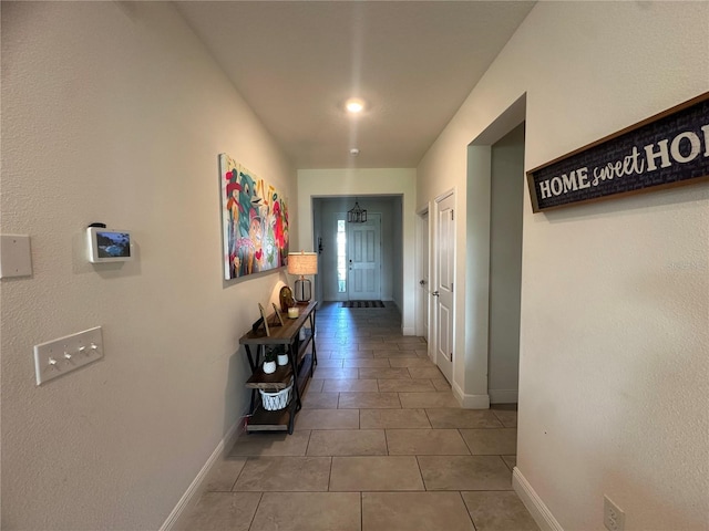 33034 Sand Creek Dr, Wesley Chapel, FL 33543 - hallway with baseboards and tile patterned flooring