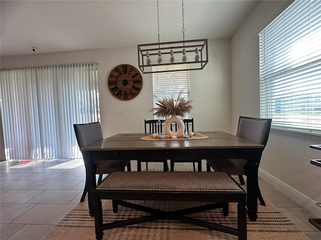 33034 Sand Creek Dr, Wesley Chapel, FL 33543 - dining area with light tile patterned flooring and baseboards