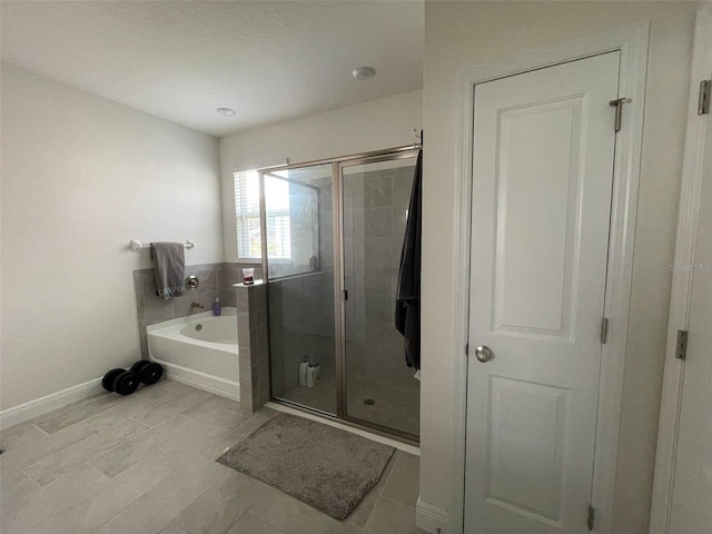 33034 Sand Creek Dr, Wesley Chapel, FL 33543 - full bath featuring a bath, a stall shower, and baseboards