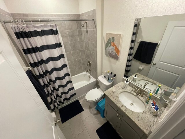 33034 Sand Creek Dr, Wesley Chapel, FL 33543 - bathroom featuring vanity, shower / tub combo, toilet, and tile patterned flooring