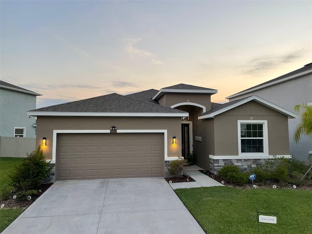 33034 Sand Creek Dr, Wesley Chapel, FL 33543 - ranch-style home with a garage, driveway, stucco siding, stone siding, and a shingled roof