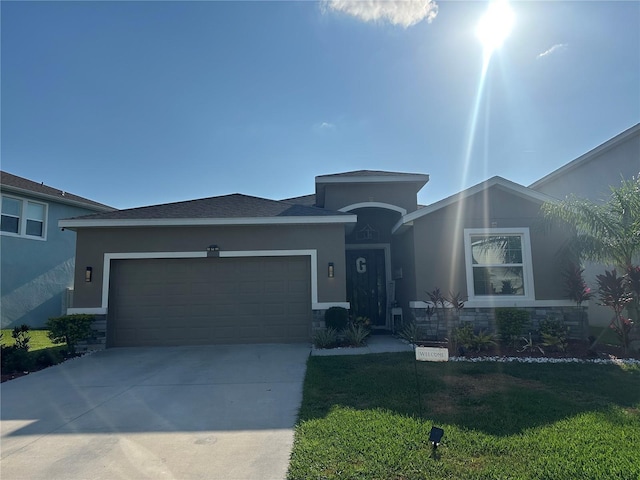 33034 Sand Creek Dr, Wesley Chapel, FL 33543 - ranch-style house with stucco siding, stone siding, driveway, and a front yard