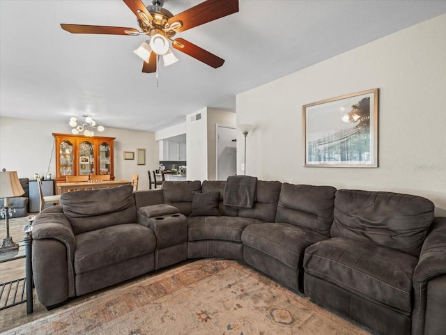 living room with visible vents and a ceiling fan
