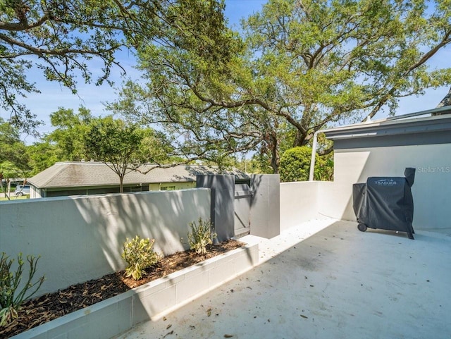 view of patio / terrace featuring fence