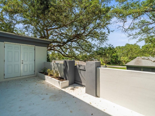 view of gate with fence