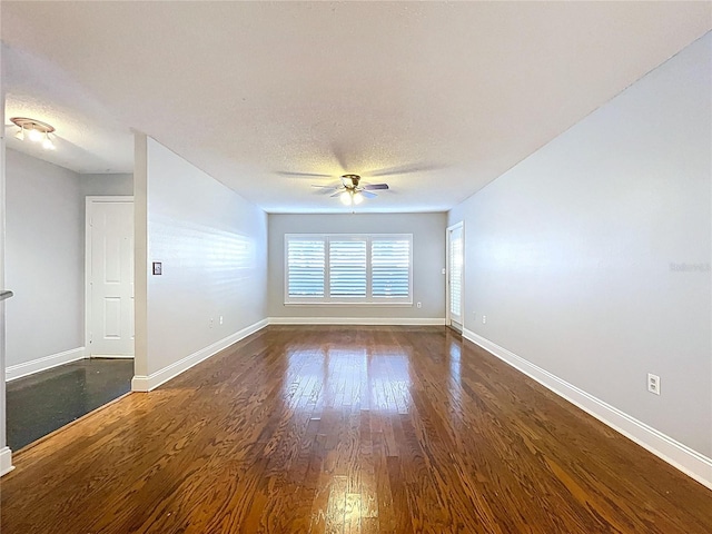 810 Island Walk Dr Unit 810, Tampa, FL 33602 - empty room featuring baseboards, a textured ceiling, ceiling fan, and dark wood-style flooring