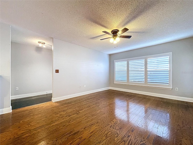 810 Island Walk Dr Unit 810, Tampa, FL 33602 - spare room with dark wood-type flooring, a textured ceiling, a ceiling fan, and baseboards
