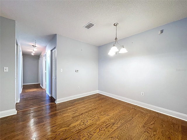 810 Island Walk Dr Unit 810, Tampa, FL 33602 - unfurnished room featuring visible vents, baseboards, and wood finished floors