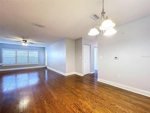 810 Island Walk Dr Unit 810, Tampa, FL 33602 - empty room with a textured ceiling, dark wood-style flooring, visible vents, baseboards, and ceiling fan