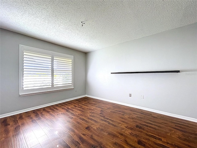 810 Island Walk Dr Unit 810, Tampa, FL 33602 - empty room featuring baseboards, wood finished floors, and a textured ceiling