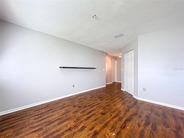 810 Island Walk Dr Unit 810, Tampa, FL 33602 - unfurnished room featuring wood finished floors, a textured ceiling, baseboards, and visible vents