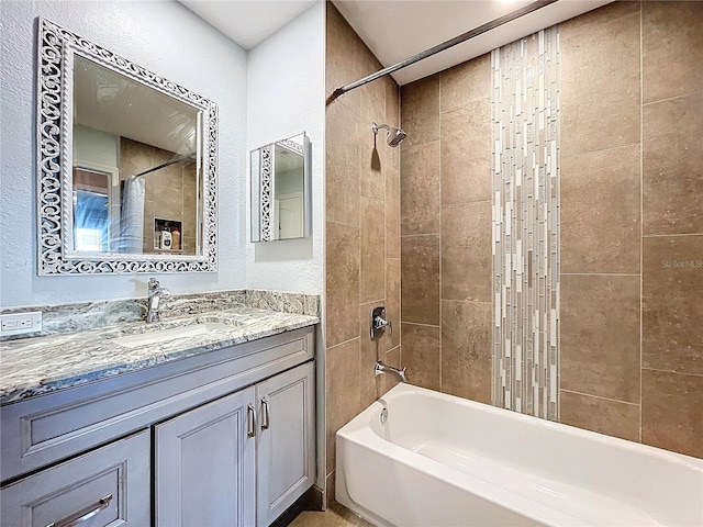810 Island Walk Dr Unit 810, Tampa, FL 33602 - full bathroom featuring a textured wall, vanity, and bathtub / shower combination