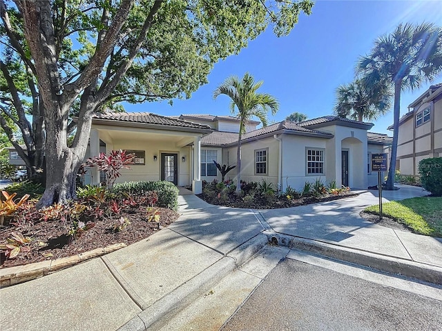 810 Island Walk Dr Unit 810, Tampa, FL 33602 - view of front of home featuring a tile roof and stucco siding