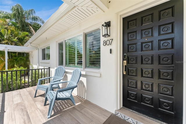 807 W Braddock St, Tampa, FL 33603 - doorway to property with a porch and stucco siding