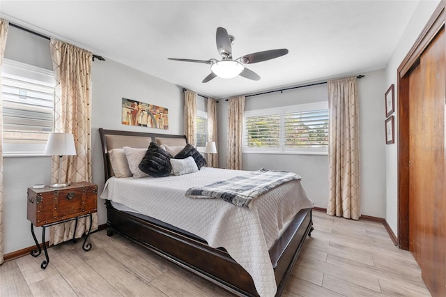 807 W Braddock St, Tampa, FL 33603 - bedroom with ceiling fan, light wood finished floors, and baseboards