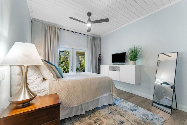 807 W Braddock St, Tampa, FL 33603 - bedroom featuring baseboards, ornamental molding, wood ceiling, wood finished floors, and french doors