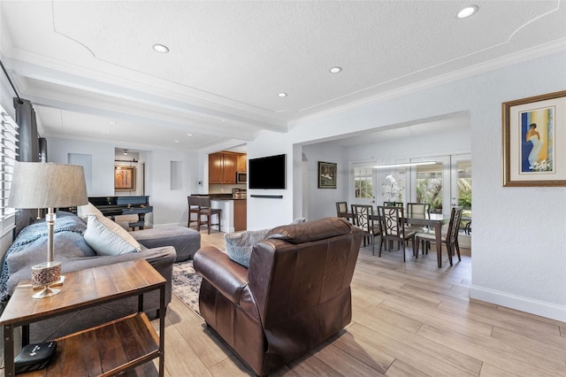 807 W Braddock St, Tampa, FL 33603 - living area featuring crown molding, beam ceiling, and light wood-style flooring