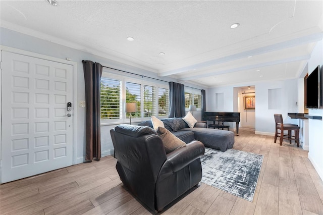 807 W Braddock St, Tampa, FL 33603 - living room with light wood-style floors, beamed ceiling, a textured ceiling, recessed lighting, and baseboards