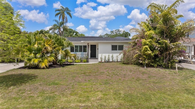807 W Braddock St, Tampa, FL 33603 - ranch-style house with a porch, stucco siding, and a front lawn