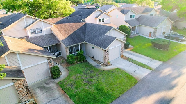 birds eye view of property with a residential view