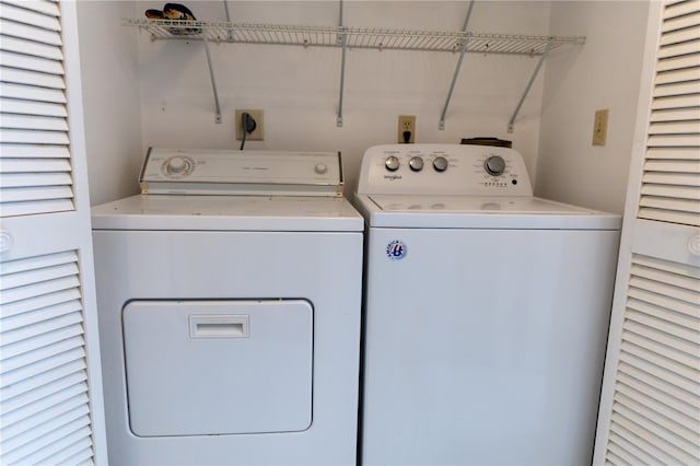 clothes washing area with laundry area and separate washer and dryer