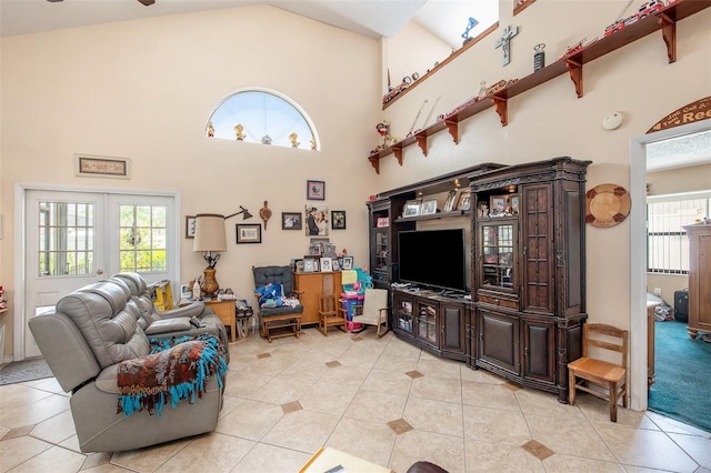 8704 Tarrington Pl, Tampa, FL 33635 - living room featuring light tile patterned floors, high vaulted ceiling, and french doors