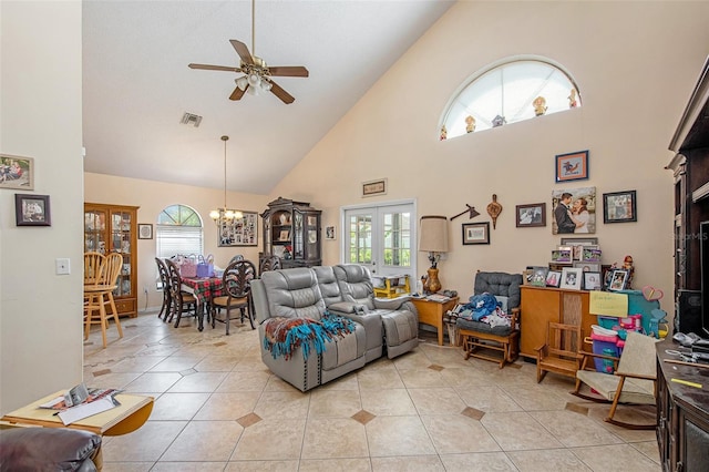 8704 Tarrington Pl, Tampa, FL 33635 - living area with a ceiling fan, a chandelier, high vaulted ceiling, healthy amount of natural light, and light tile patterned floors