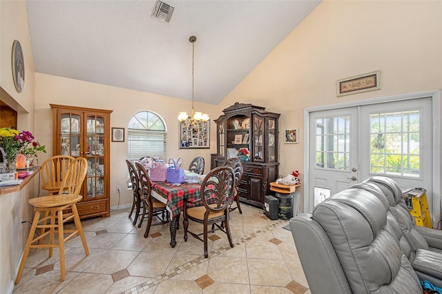 8704 Tarrington Pl, Tampa, FL 33635 - dining room with a chandelier, light tile patterned floors, and high vaulted ceiling