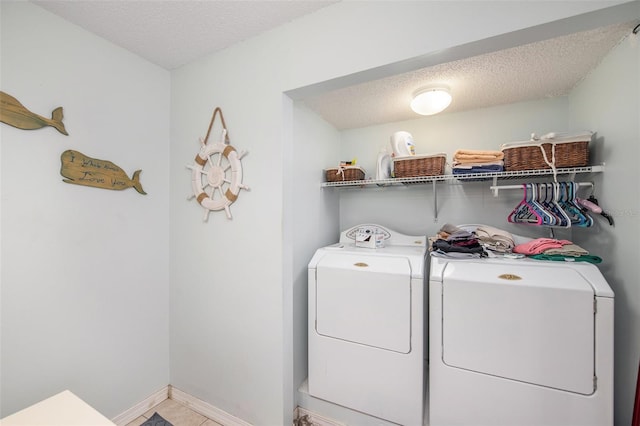 8704 Tarrington Pl, Tampa, FL 33635 - washroom with independent washer and dryer, a textured ceiling, baseboards, and tile patterned floors
