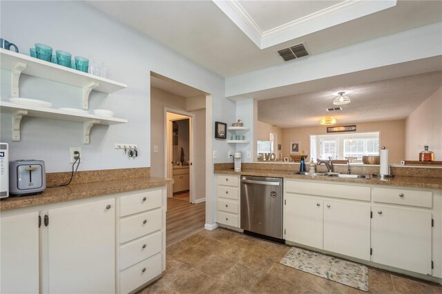 kitchen featuring white cabinets, open shelves, dishwasher, visible vents, and a sink