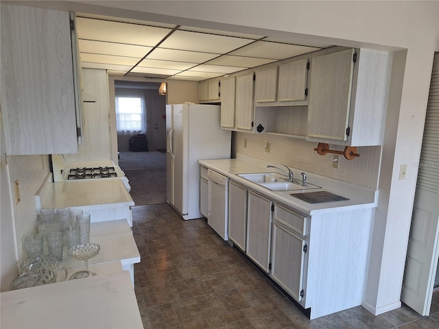 kitchen with range hood, a sink, light countertops, white appliances, and backsplash