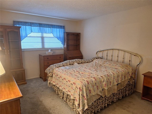 carpeted bedroom with a textured ceiling
