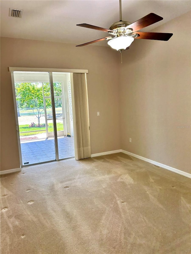 1201 Ventana Dr, Sun City Center, FL 33573 - empty room featuring baseboards, a ceiling fan, visible vents, and carpet floors