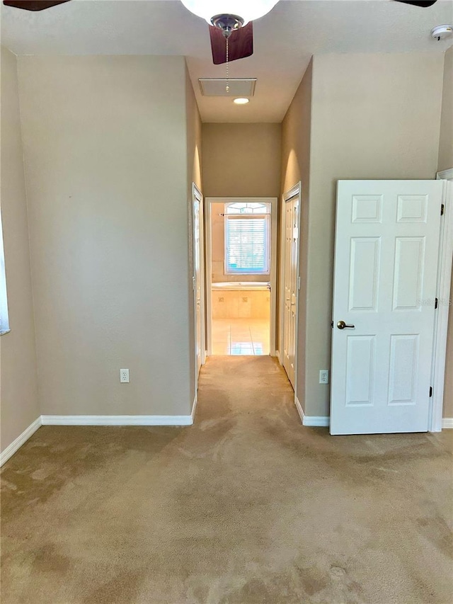 1201 Ventana Dr, Sun City Center, FL 33573 - hallway featuring carpet, baseboards, and attic access