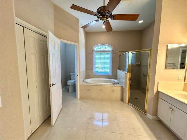 1201 Ventana Dr, Sun City Center, FL 33573 - full bathroom with a bath, toilet, vanity, tile patterned floors, and a stall shower