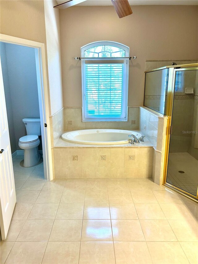 1201 Ventana Dr, Sun City Center, FL 33573 - full bath featuring toilet, tile patterned floors, a shower stall, and a garden tub